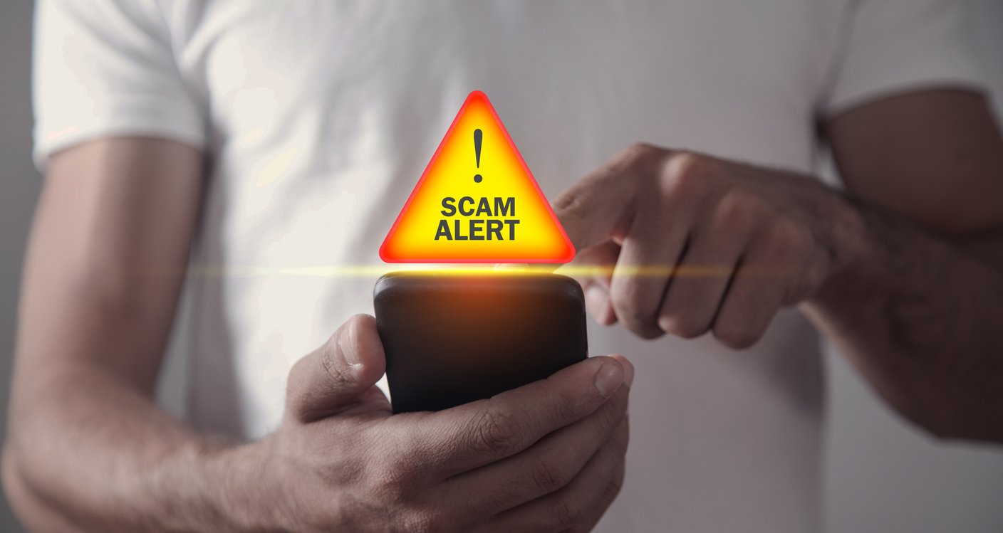 Scam alert pops up over a phone