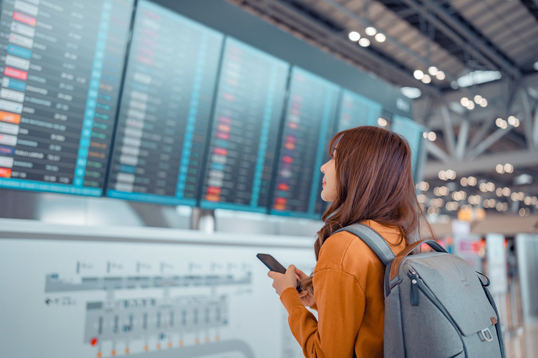 airport flight board woman