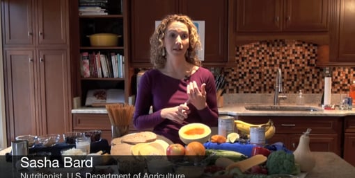Nutrition Sasha Bard of the USDA poses in her kitchen.